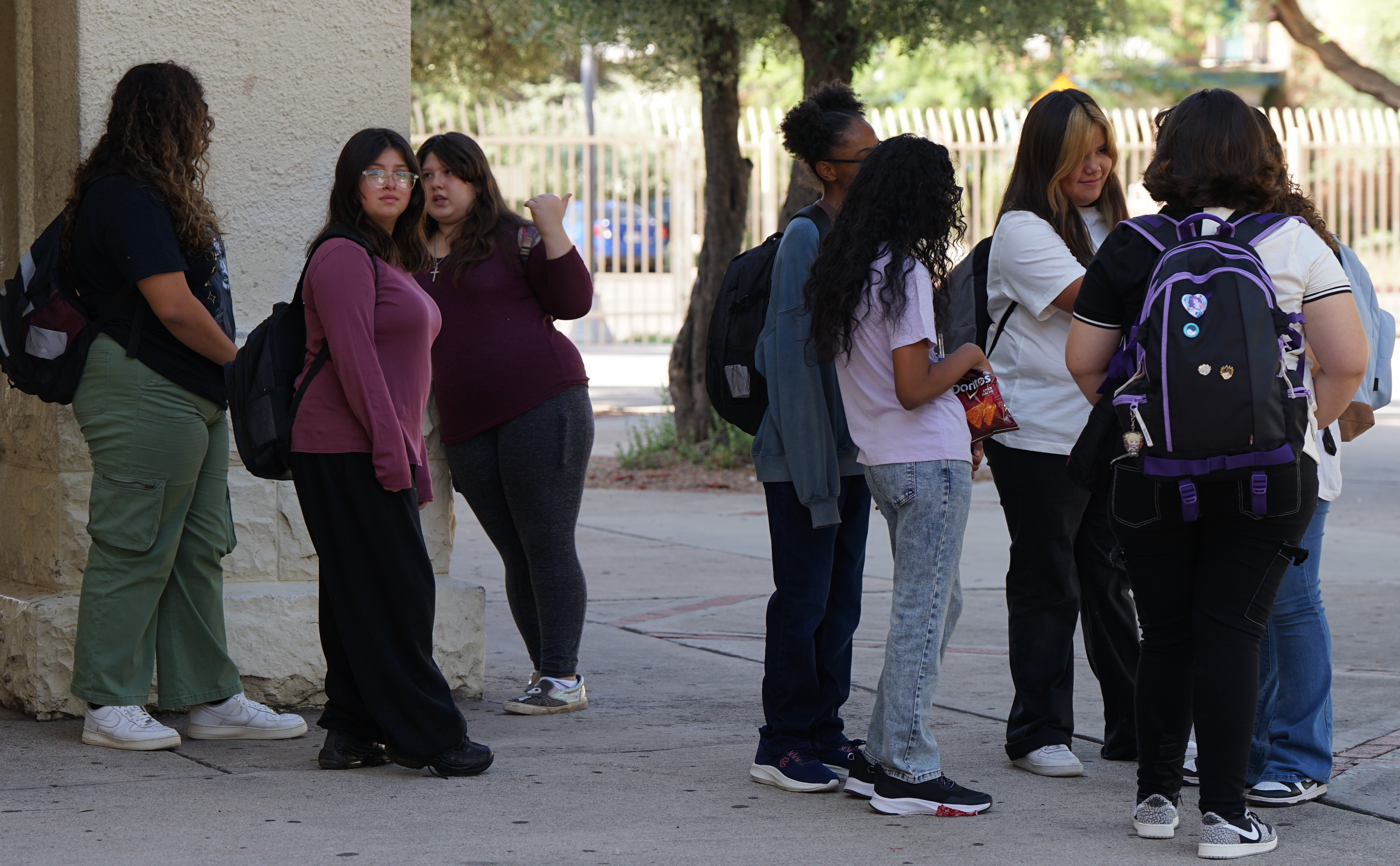 Middle school girls hang out outside during lunch