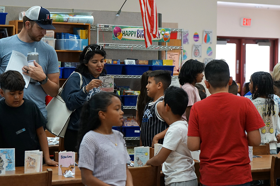 Parents and students browse the selection of zines