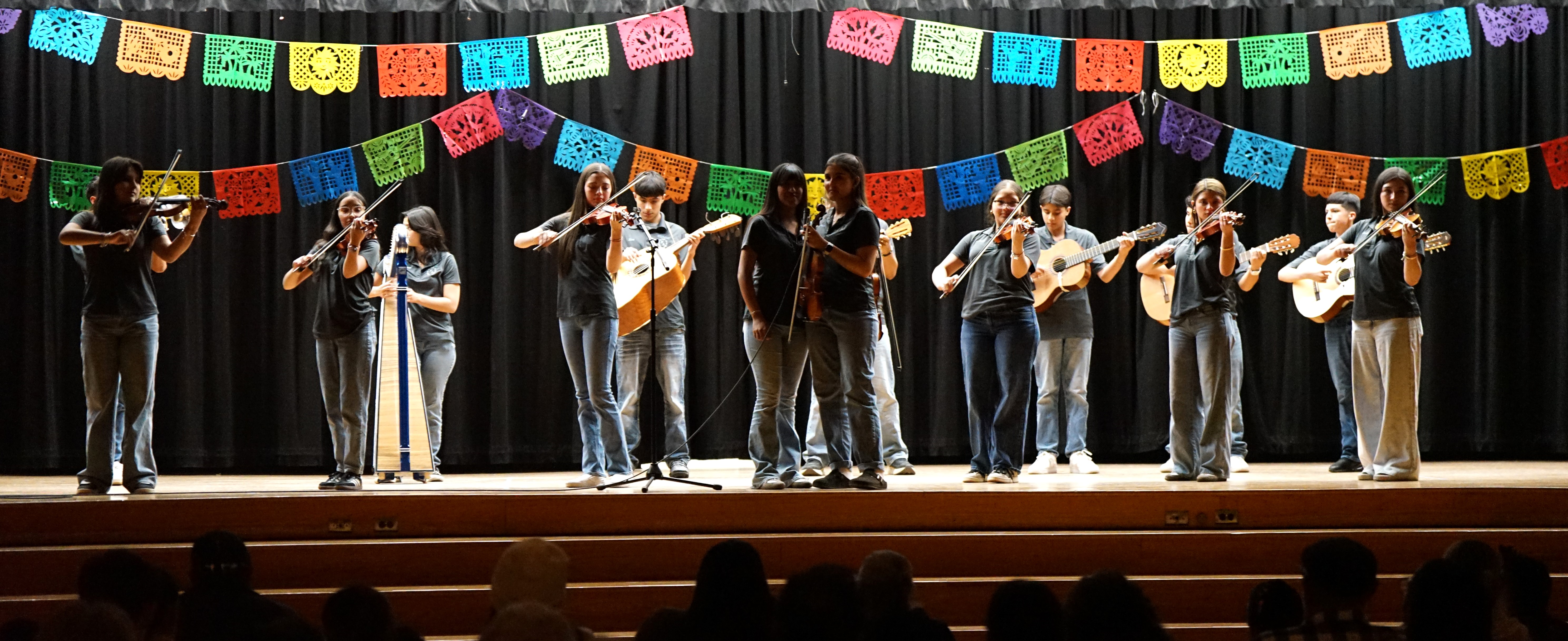 students play instruments on the stage